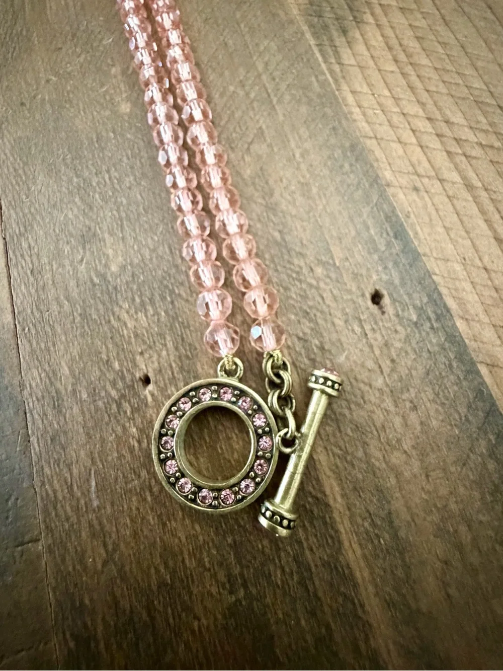 HEIDI DAUS PINK BEADED CRYSTAL NECKLACE FEATURING A QUATREFOIL-SHAPED PENDANT